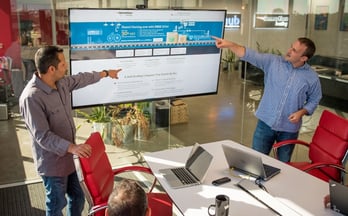 InMotion Hosting's Sunil Saxena leads a team meeting
