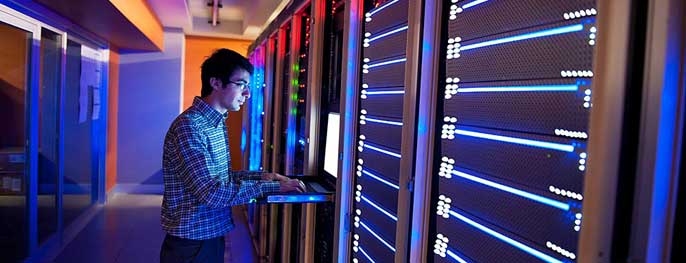 Man in a server room Man in a server room