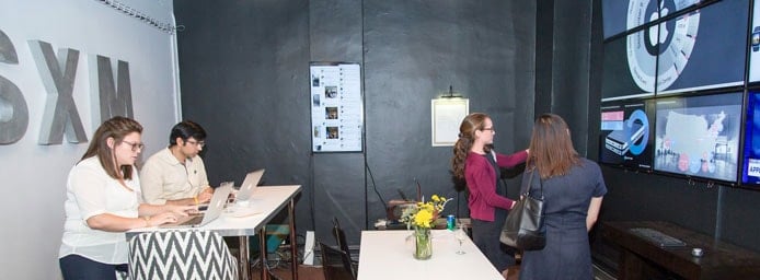 Sprinklr employees working in an office