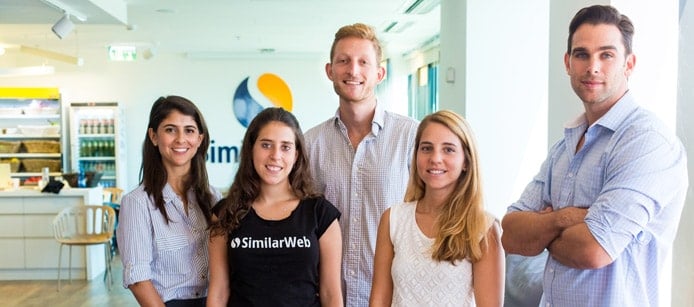 Five SimilarWeb employees in the office Five SimilarWeb employees in the office