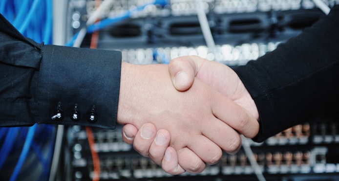 Handshake in front of servers Handshake in front of servers