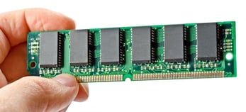 Picture of a hand holding a memory chip