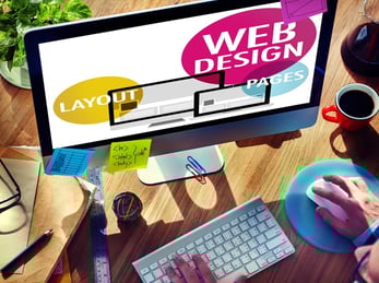 Depiction of someone at a desktop computer designing a website Depiction of someone at a desktop computer designing a website