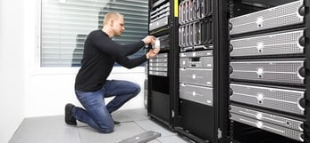 Image of an IT expert working on a server