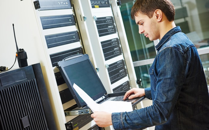 Technician performing server maintenance Technician performing server maintenance
