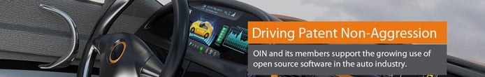 Photo of a car dashboard and text reading "Driving Patent Non-Aggression" Photo of a car dashboard and text reading "Driving Patent Non-Aggression"