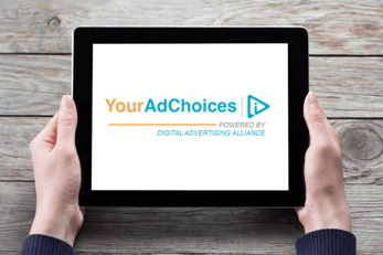 Photo of a tablet with the YourAdChoices logo on the screen
