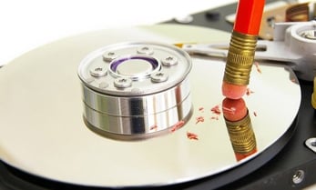 Image of HDD being 'erased' with pencil eraser