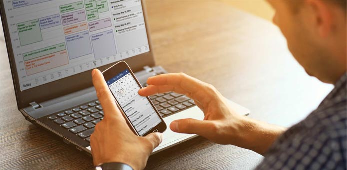 Image of person using FastMail on a laptop and cell phone Image of person using FastMail on a laptop and cell phone