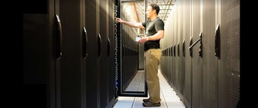Image of a person working at a datacenter