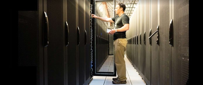 Image of a person working at a datacenter Image of a person working at a datacenter