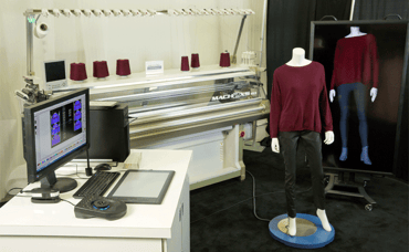 Photo of Shima Seiki's 3D knitting machine in the Intel booth