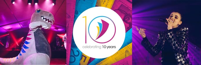 A photo of the company mascot, 10-year anniversary logo, and a singer at a recent celebration A photo of the company mascot, 10-year anniversary logo, and a singer at a recent celebration