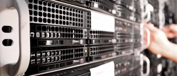 Image of hands working on a server Image of hands working on a server