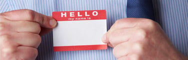 Man placing a name tag