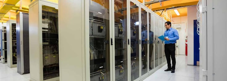 Image of a man in a datacenter Image of a man in a datacenter