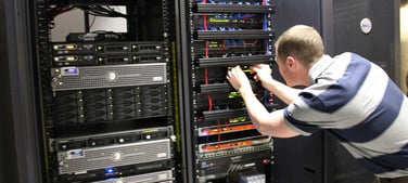 Image of a man working on a server