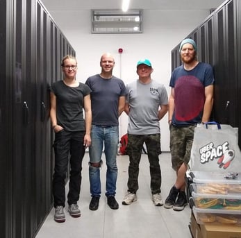 Photo of Uberspace team members in the server room