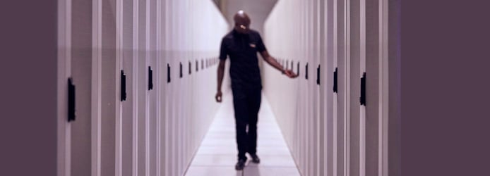Man in datacenter Man in datacenter