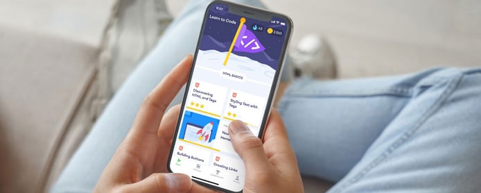Photo of person holding phone with Mimo app on the screen