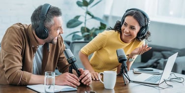 man and woman hosting a podcast