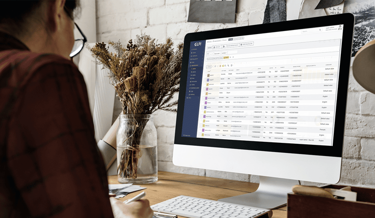 Woman using GLPI on desktop