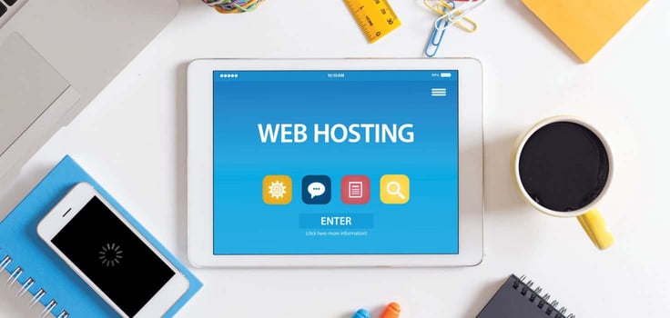 web hosting icons and items sitting on a desk web hosting icons and items sitting on a desk