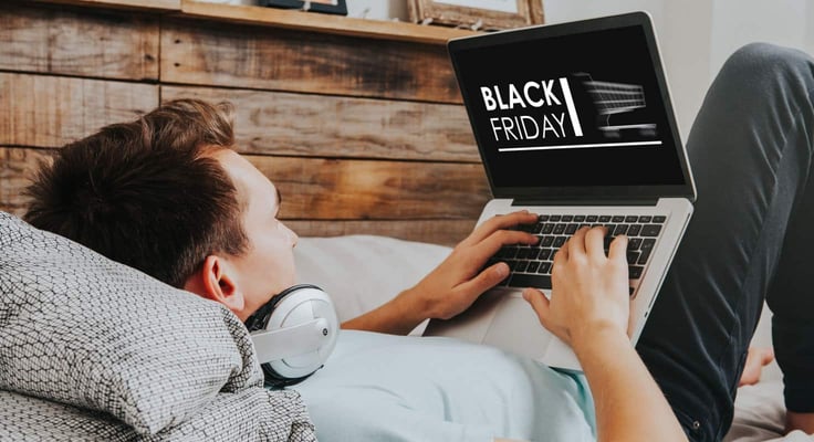 Person Black Friday shopping on a laptop Person Black Friday shopping on a laptop
