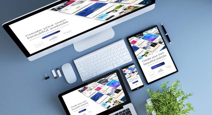 Computer and tablets showing website layouts Computer and tablets showing website layouts