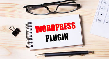 Notebook with the words "WordPress" plugin