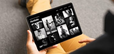 Man holding a tablet with a portfolio website