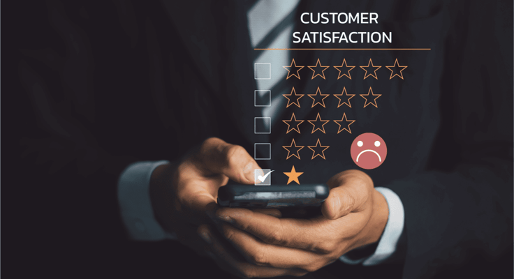 A man holding a cellphone giving a one-star rating for customer satisfaction. A man holding a cellphone giving a one-star rating for customer satisfaction.