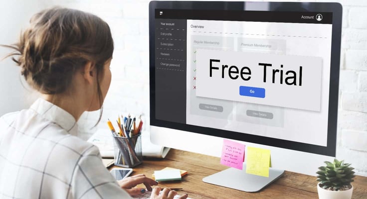 A Woman Searching for a Free Trial on Her Computer A Woman Searching for a Free Trial on Her Computer