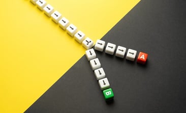 A stock image of two paths diverging from one, leading to path A and path B.