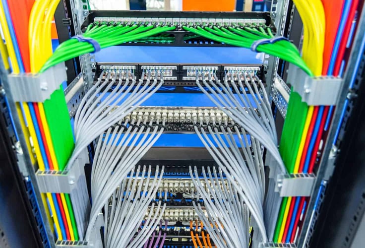 The back of a server with cables connected to it. The back of a server with cables connected to it.
