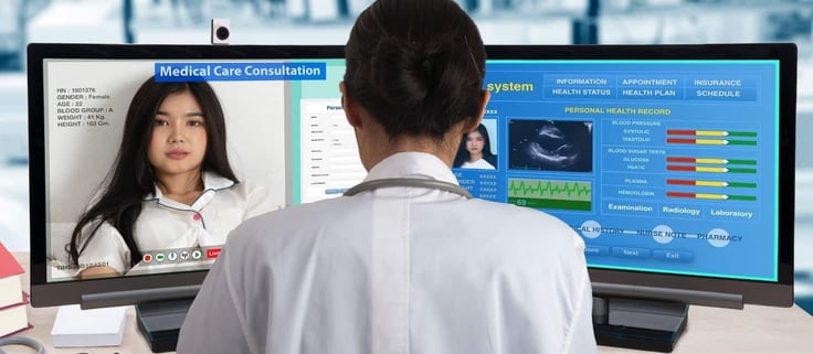 Doctor checking a patients health records during video call.