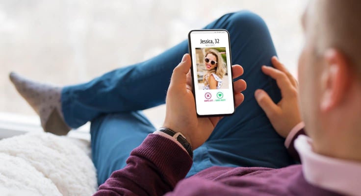 Man using dating app on mobile phone