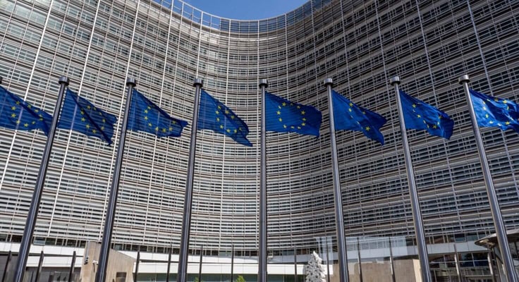 European flags in front of headquarters of European commission in Brussels in summer day
