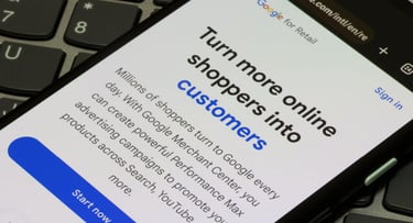 Introduction to Google Merchant Center and Google Performance Max advertising campaigns is seen on the webpage of Google for Retail on a smartphone.