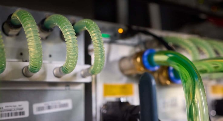 Close-up view of modern server hardware with liquid cooling pipes ensuring optimal temperature control Close-up view of modern server hardware with liquid cooling pipes ensuring optimal temperature control