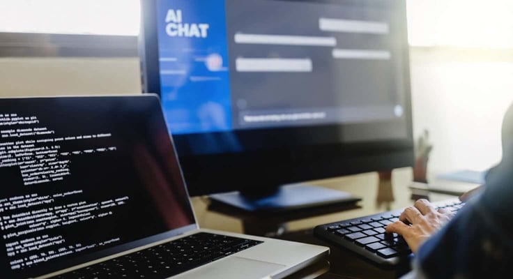 Programmer using generative artificial intelligence for software development inside office