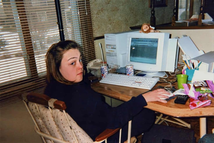 Circa 1998 - Minnesota: Teen girl uses America Online (AOL) surfing the internet at a desktop computer, with lots of snacks and soda pop. Image is a vintage scan and may have imperfections Circa 1998 - Minnesota: Teen girl uses America Online (AOL) surfing the internet at a desktop computer, with lots of snacks and soda pop. Image is a vintage scan and may have imperfections