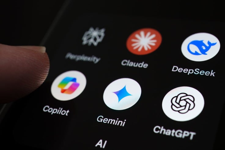 Finger interacting with a smartphone screen displaying AI apps including Perplexity, Claude, DeepSeek, Copilot, Gemini, and ChatGPT inside a folder labeled AI Finger interacting with a smartphone screen displaying AI apps including Perplexity, Claude, DeepSeek, Copilot, Gemini, and ChatGPT inside a folder labeled AI