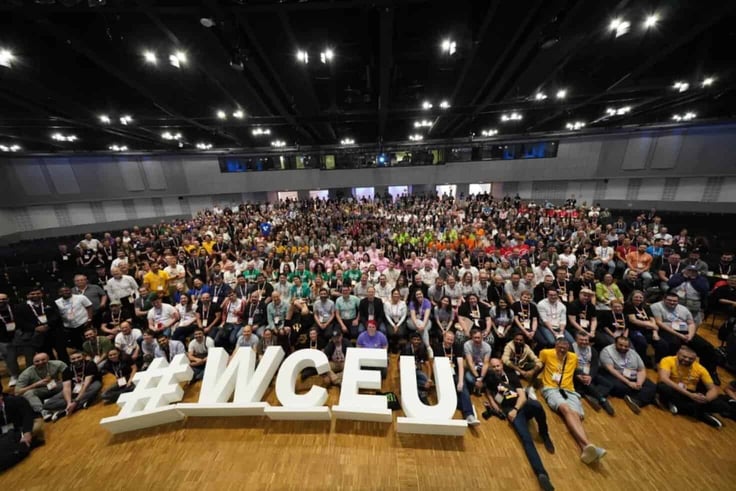 A group of people posing for a photo with '#WCEU' letters A group of people posing for a photo with '#WCEU' letters