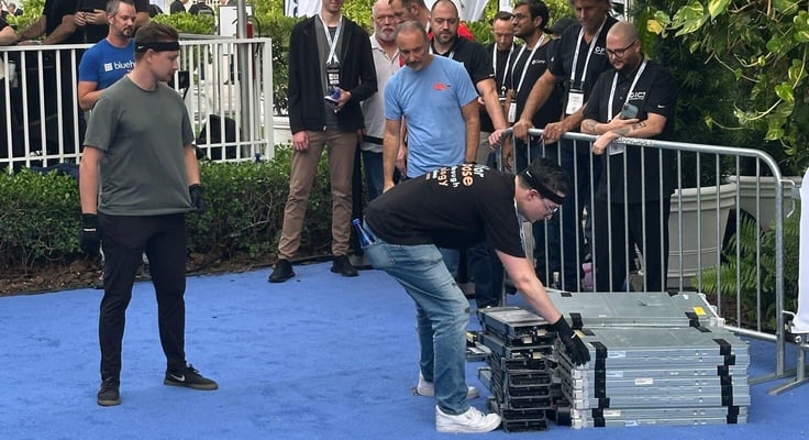 A photo of a man preparing to throw a server A photo of a man preparing to throw a server