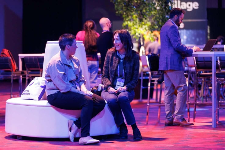 Two RSA 2026 attendees talking in the conference lounge area at Moscone Center Two RSA 2026 attendees talking in the conference lounge area at Moscone Center