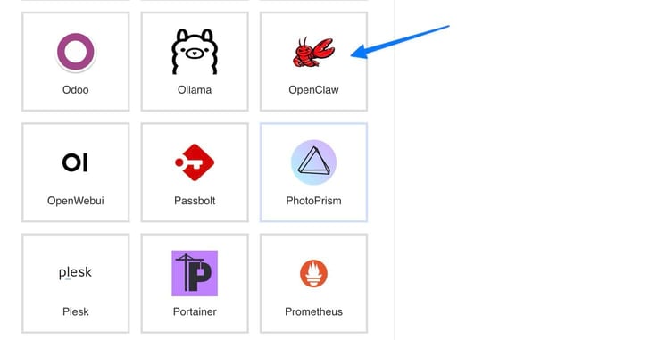 Kamatera marketplace app image grid showing a blue arrow pointing to the OpenClaw app tile with its red lobster claw mascot logo, alongside neighboring apps including Odoo, Ollama, OpenWebUI, Passbolt, PhotoPrism, Plesk, Portainer, and Prometheus