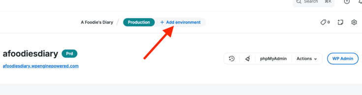 In menu bar showing red arrow pointing to + Add Environment