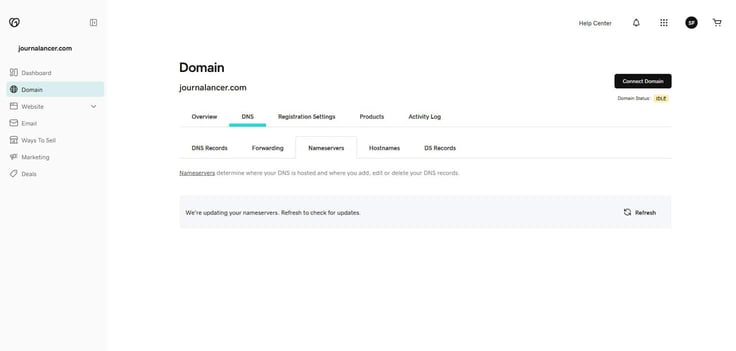 GoDaddy domain management DNS Nameservers tab for journalancer.com showing a pending update status message reading 'We're updating your nameservers. Refresh to check for updates' with a Refresh button on the right and Domain Status showing IDLE