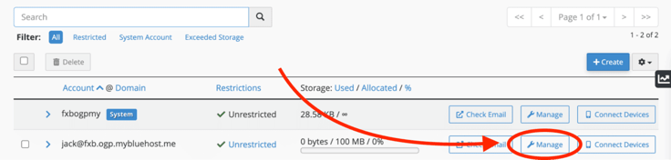 Bluehost cPanel Email Accounts table showing two accounts â system account fxbogpmy with a blue System badge and unlimited storage, and Bluehost email with 100 MB allocated at 0 bytes used â each with Check Email, Manage, and Connect Devices buttons, with red arrow pointing to Manage option in the bottom right for Bluehost email. Bluehost cPanel Email Accounts table showing two accounts â system account fxbogpmy with a blue System badge and unlimited storage, and Bluehost email with 100 MB allocated at 0 bytes used â each with Check Email, Manage, and Connect Devices buttons, with red arrow pointing to Manage option in the bottom right for Bluehost email.